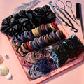 Hair accessory set with scrunchies, elastic bands, plastic styling tools, and a hair comb on a pink tray.