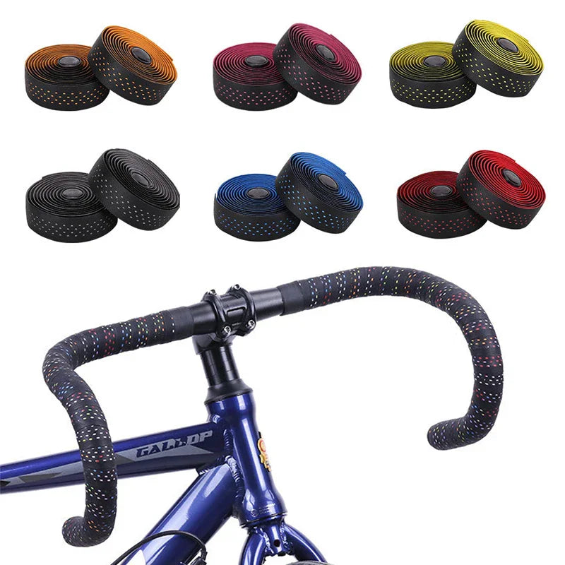 Rolls of road bike handlebar tapes alongside a installed tape on a bicycle handlebar
