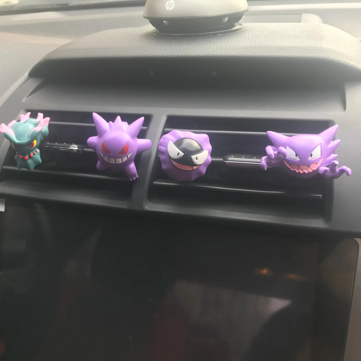 Four distinct ghost type monster figures used as car interior vent decorations