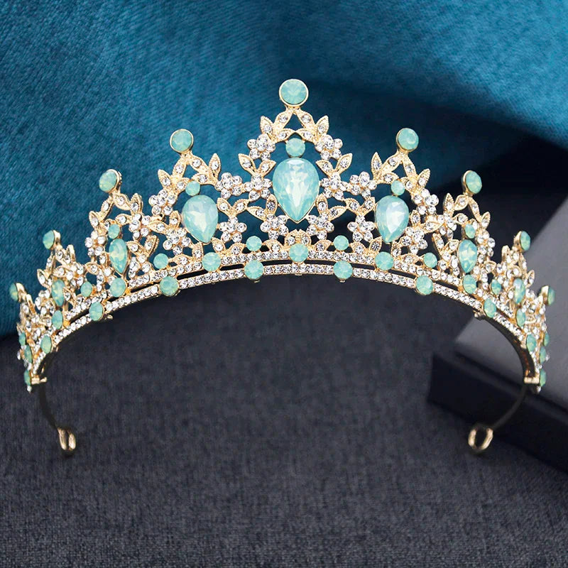 Gold tiara with light green teardrop and round rhinestones