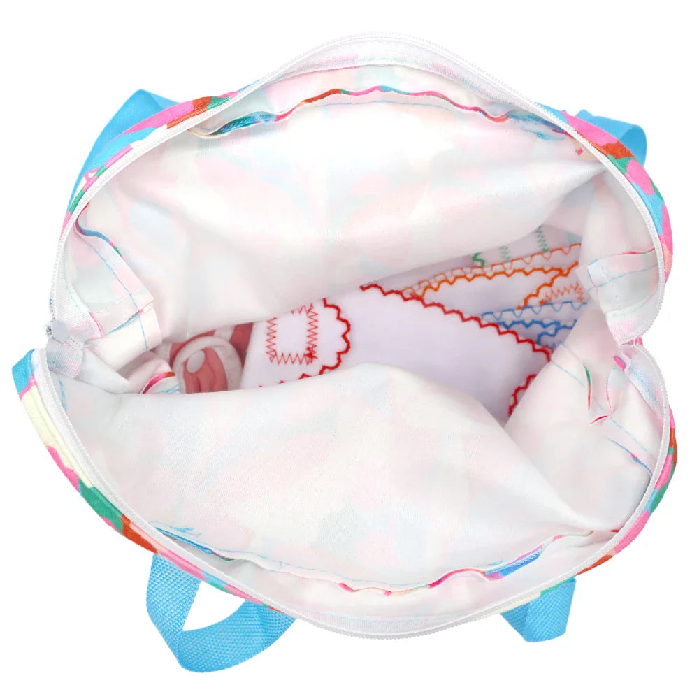 Interior view of a patterned fabric doll carrier backpack.