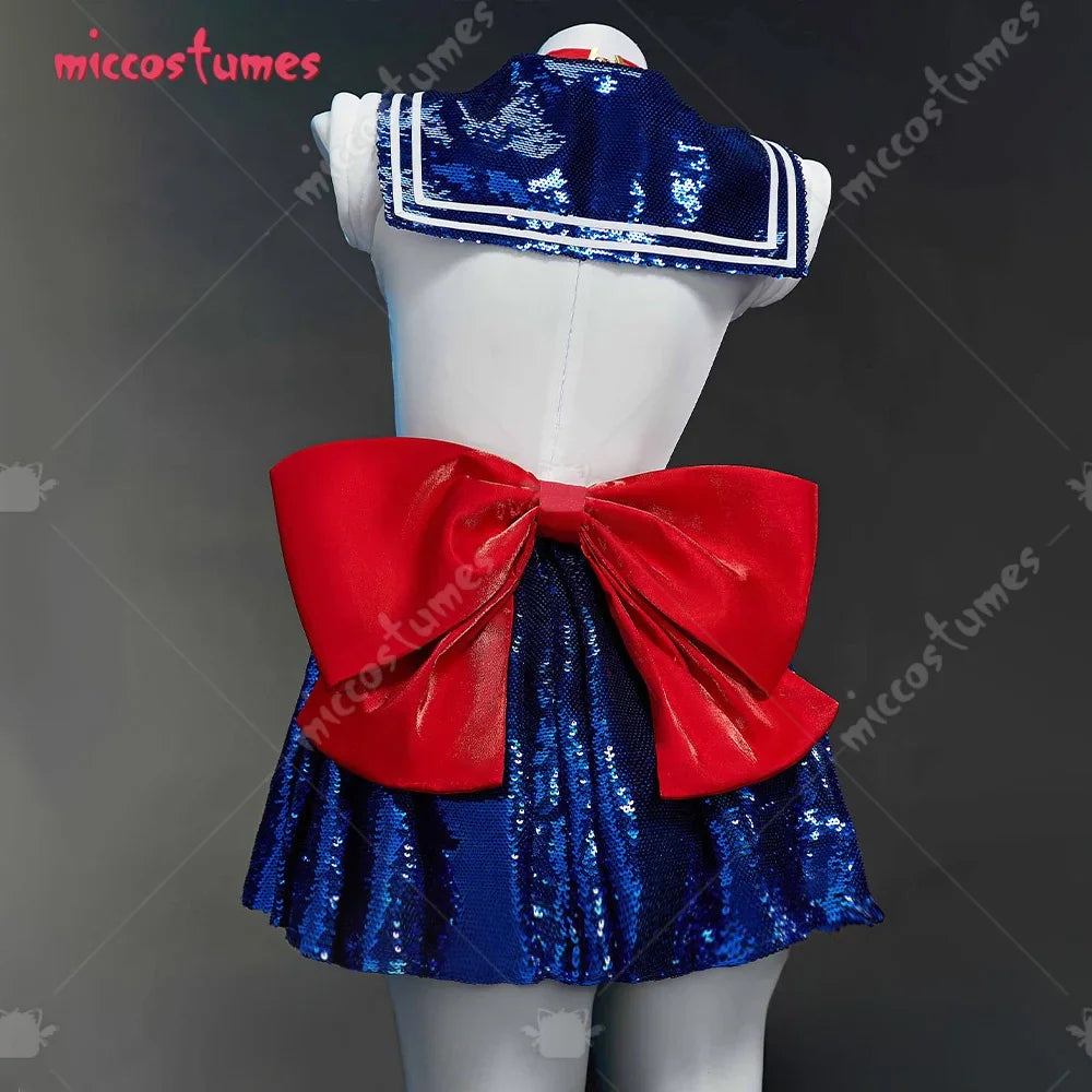 Back view of a blue sequin sailor-style cosplay dress with a large red bow