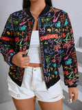 Close-up of a black bomber jacket with colorful neon-style graffiti print.