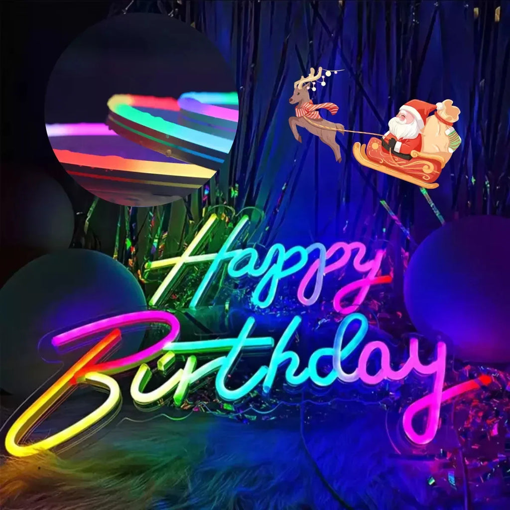 Colorful LED neon strip light arranged in a happy birthday shape with a Christmas decoration