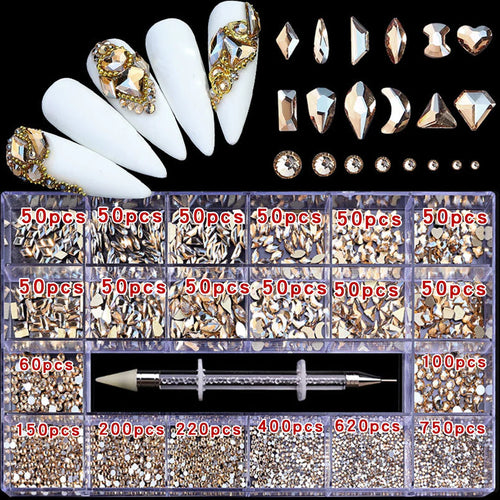 A storage box with gold-toned assorted nail art rhinestones and a tool, shown with decorated nail tips.