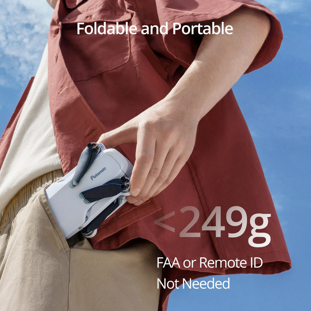 Person folding a portable mini drone to fit in their pocket