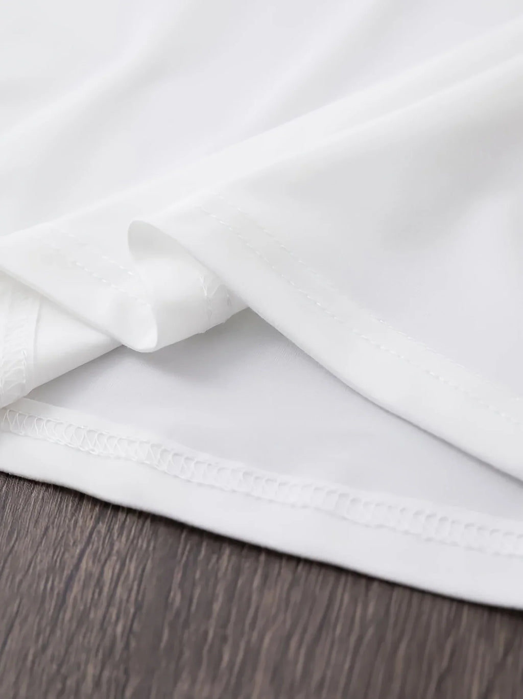Close up of white t-shirt hem and stitching