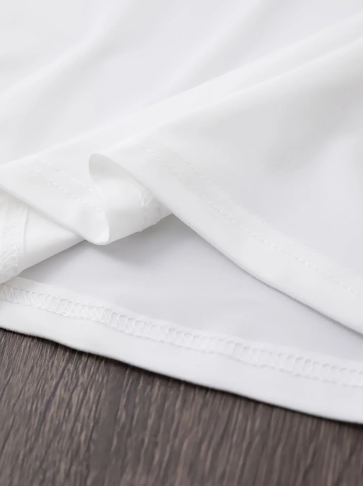 Close up of white t-shirt hem and stitching