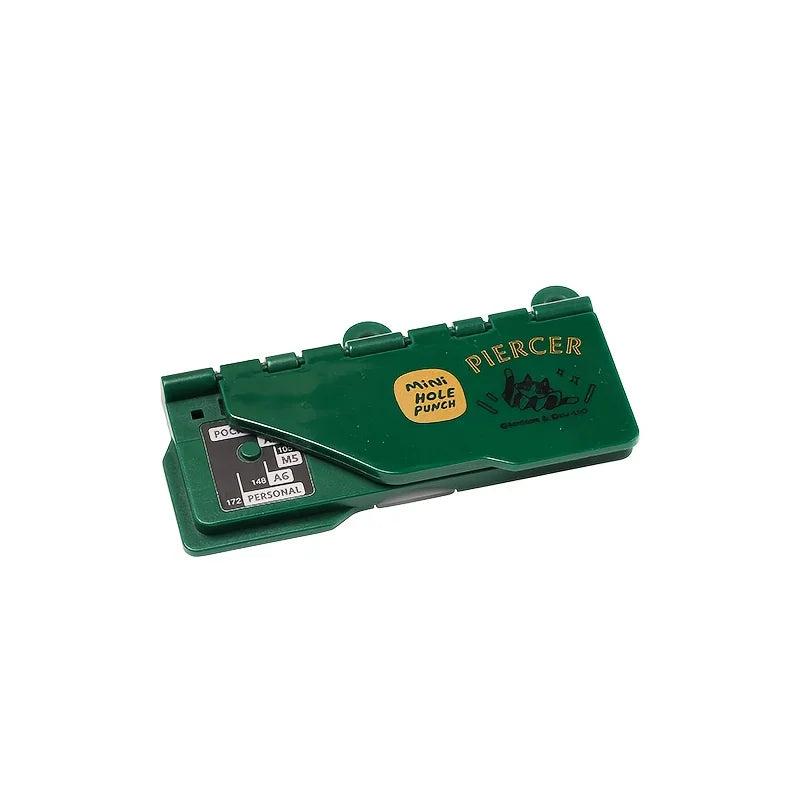 A green portable mini hole puncher isolated on a white background.