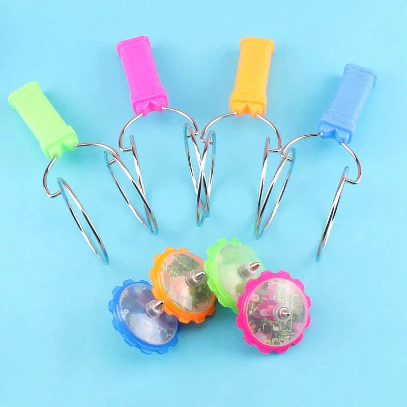 Set of four magnetic spinning top toys with LED lights and separate handles