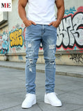 Men wearing light blue slim fit ripped skinny jeans with white t-shirt and white sneakers