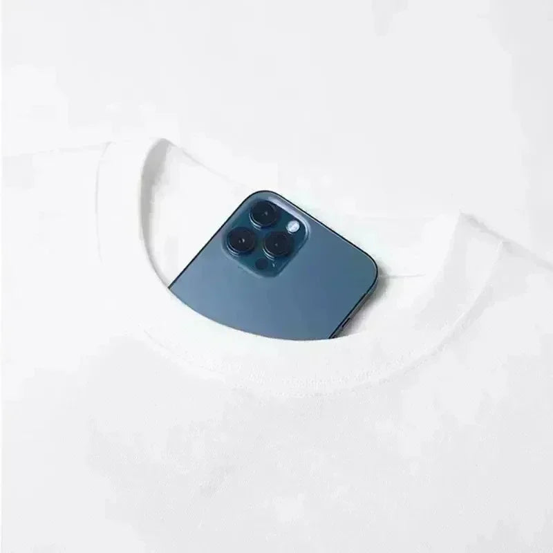 Smartphone placed inside the collar of a plain white t-shirt