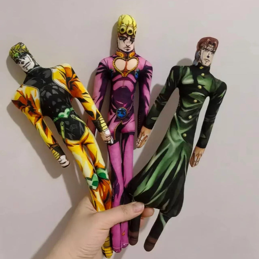 Hand holding three anime character plush dolls featuring colorful outfits