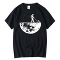 Black crew neck t-shirt with a white graphic of an astronaut mowing the moon