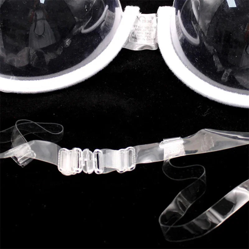 Close-up of the clasp and strap details of a clear plastic bra.