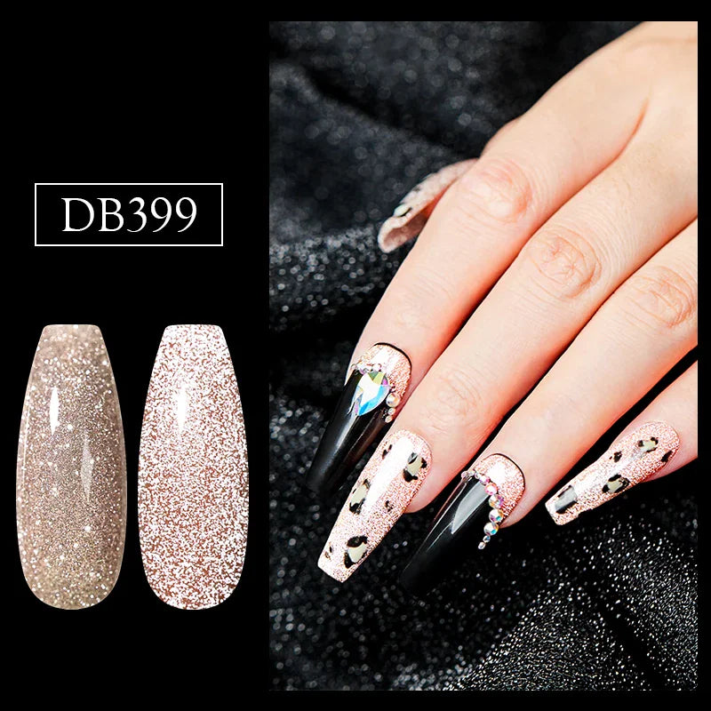 A close-up of a manicure using glittery nude gel polish with animal print and gem accents.