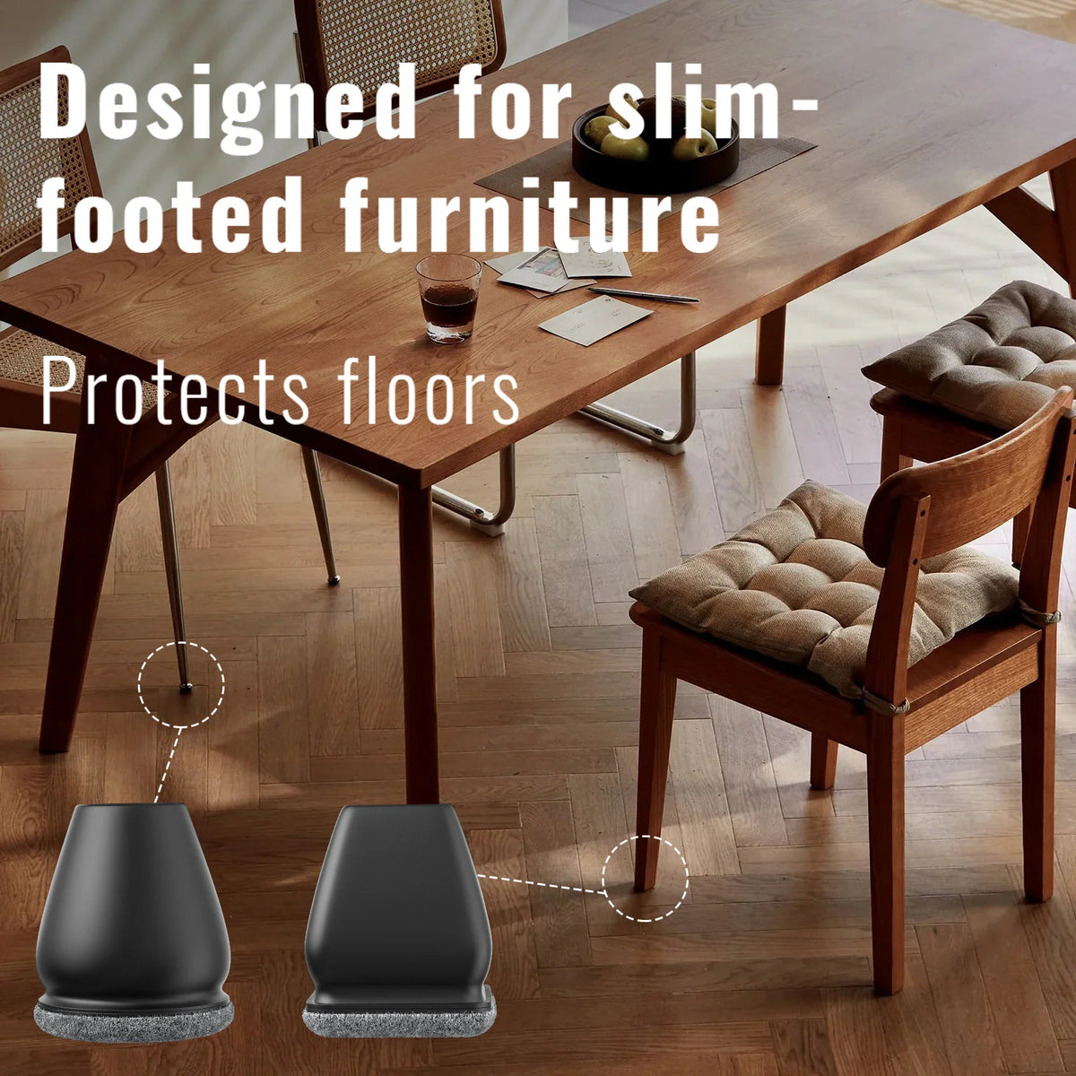Black furniture leg covers installed on a dining room table and chair set to protect the wooden floor