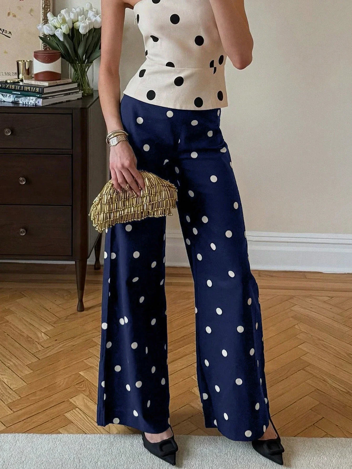 High-waisted navy blue polka dot wide-leg trousers