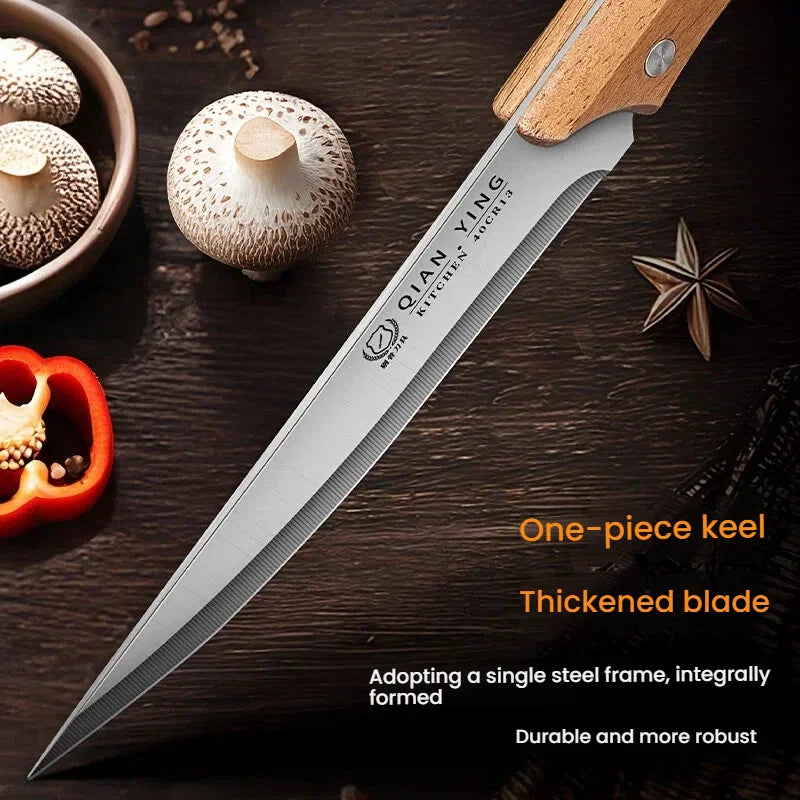 Close-up of a stainless steel kitchen knife with a wooden handle near mushrooms and spices