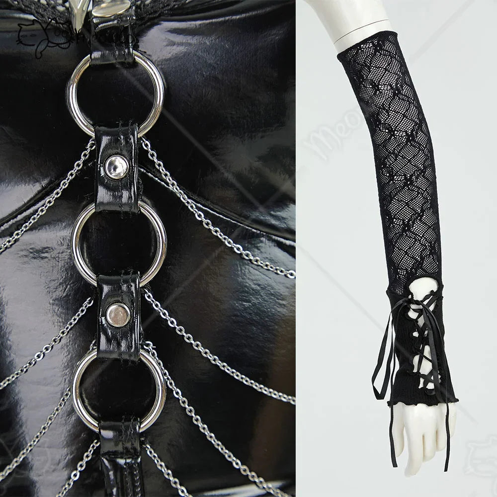 Close-up detail of black faux leather corset with chain accents and black lace-up mesh sleeves