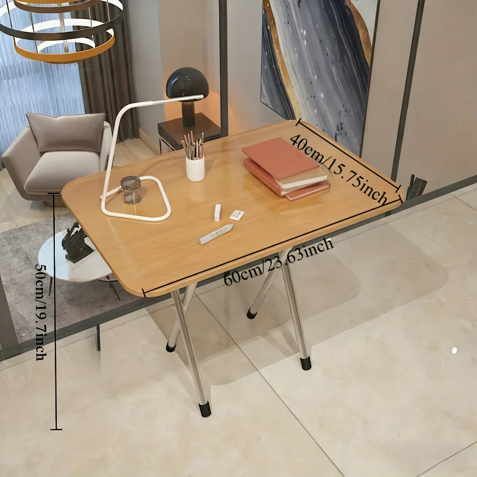 A small folding desk with light wood top and metal legs showing dimensional measurements for length and width.
