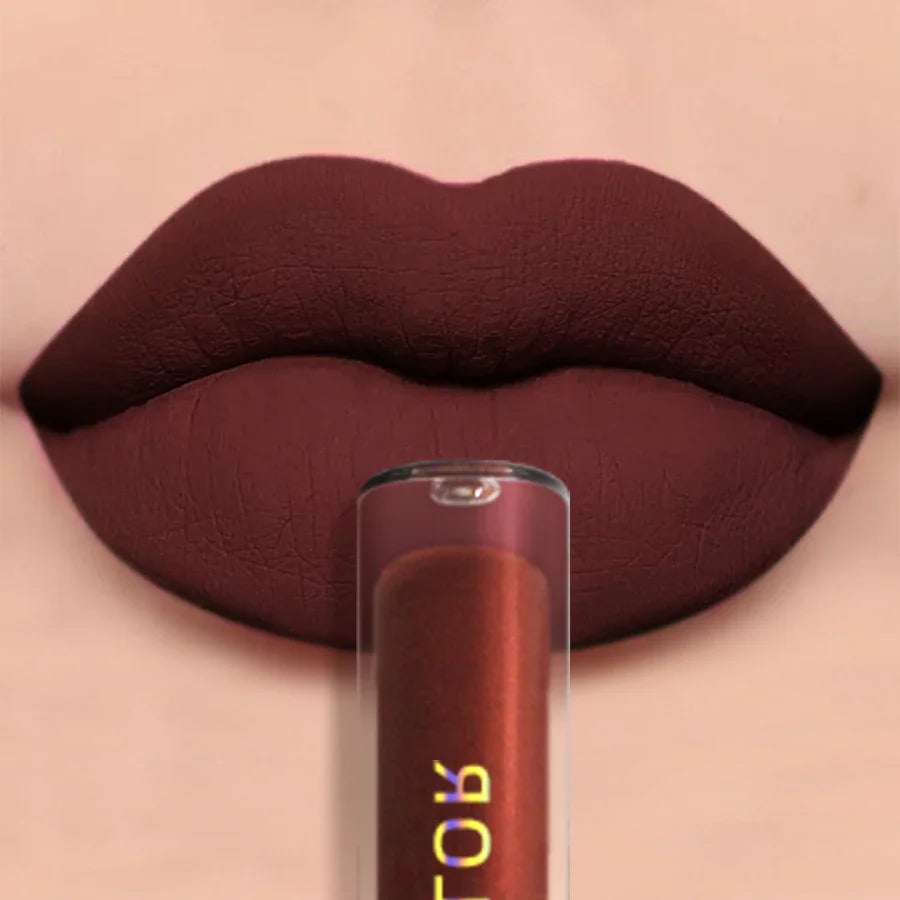 Dark maroon liquid lipstick tube placed in front of dark red lips