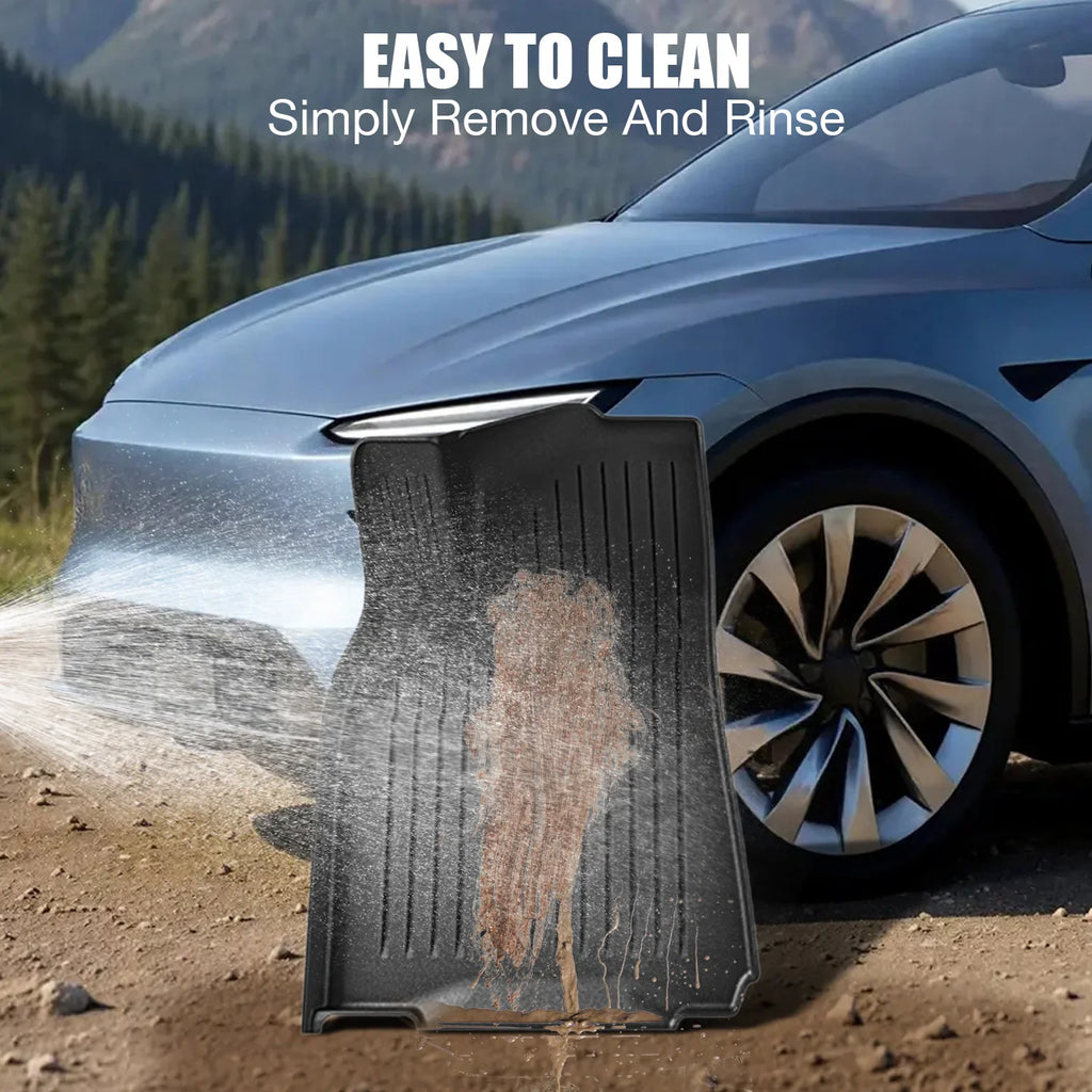 Cleaning a black all-weather rubber floor mat by rinsing it with water