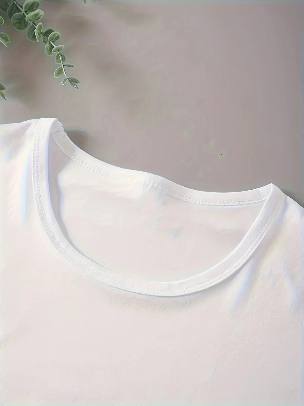 Close-up of the round neck collar on a plain white t-shirt