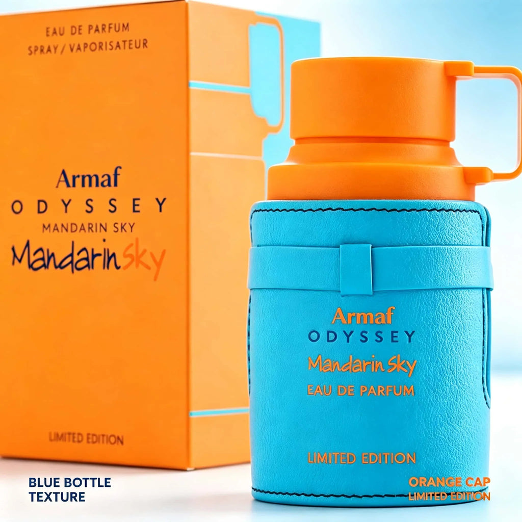 Close up of a blue and orange perfume bottle and its box with orange cap detail