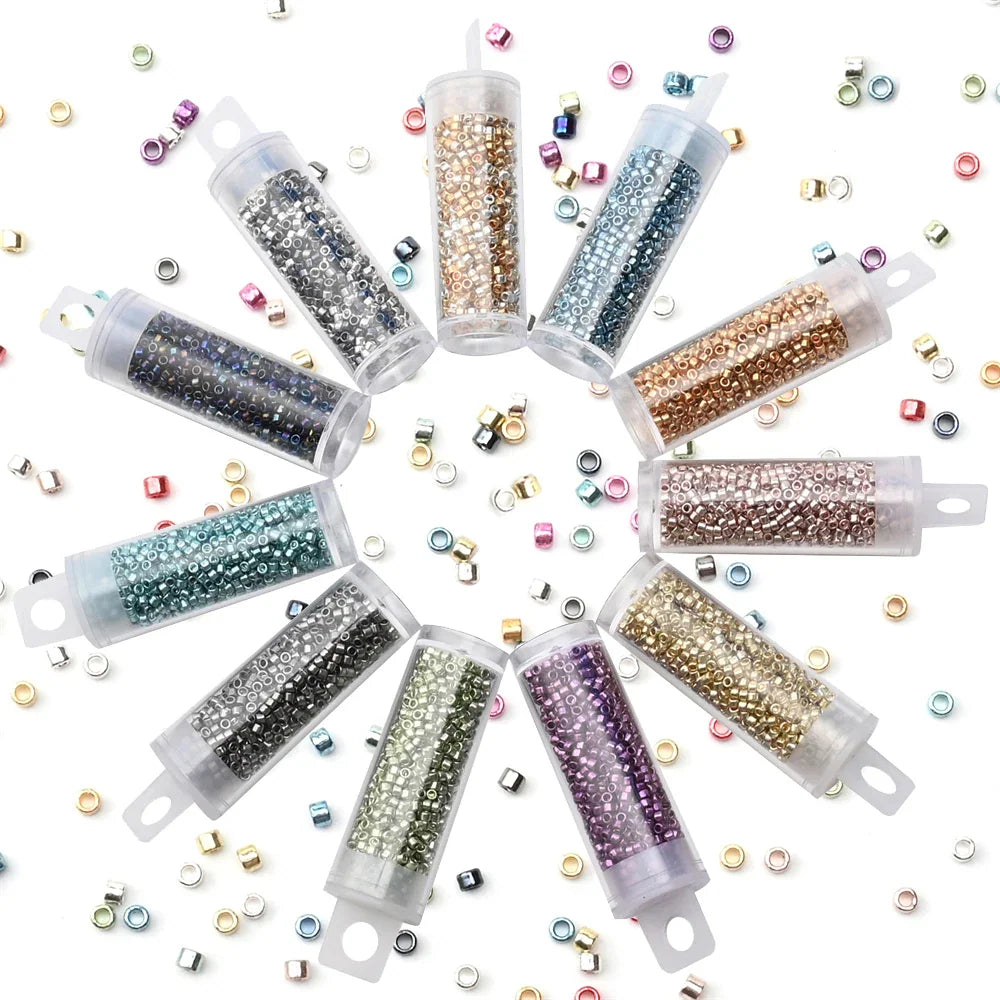 A circular arrangement of tubes filled with various colorful metallic glass seed beads for jewelry making.