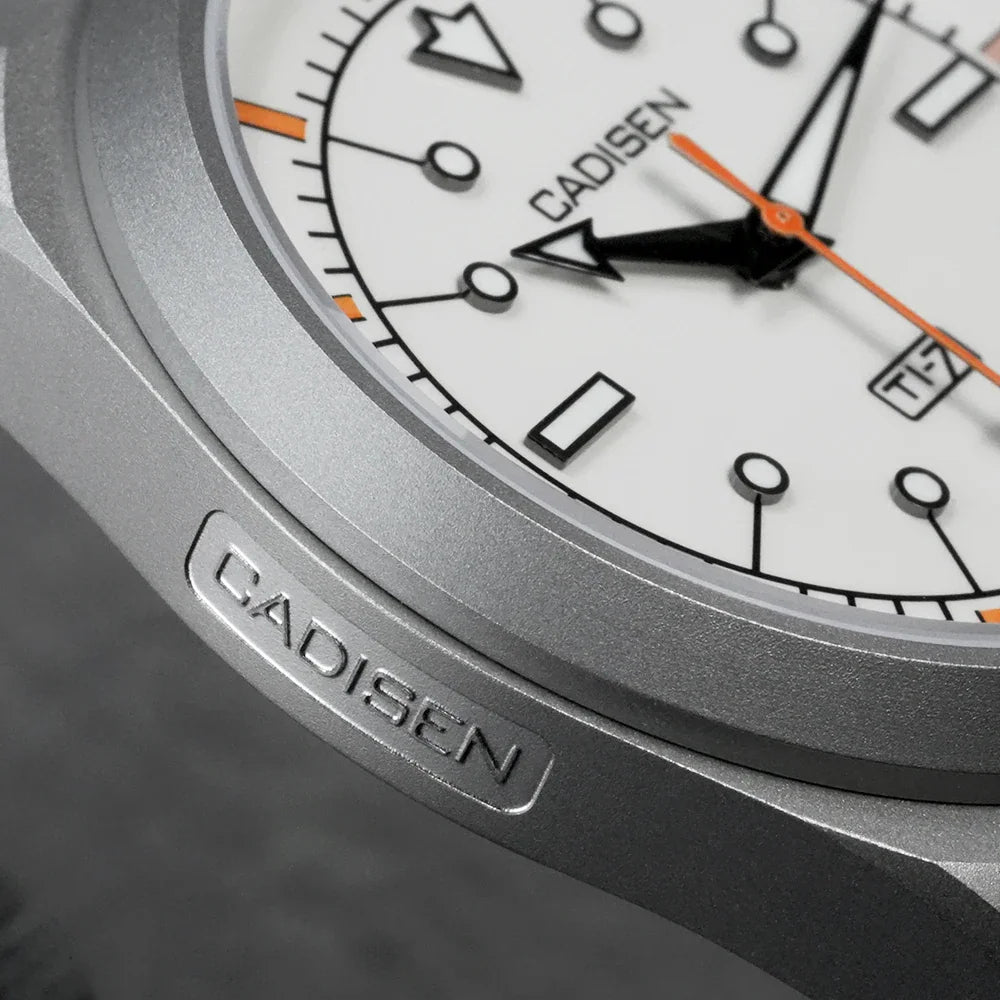 Close-up of a white-dial watch case with titanium bezel detail