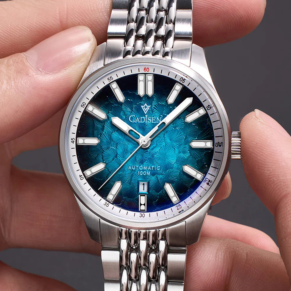 Silver automatic men's wristwatch with a blue patterned dial and metal link bracelet.