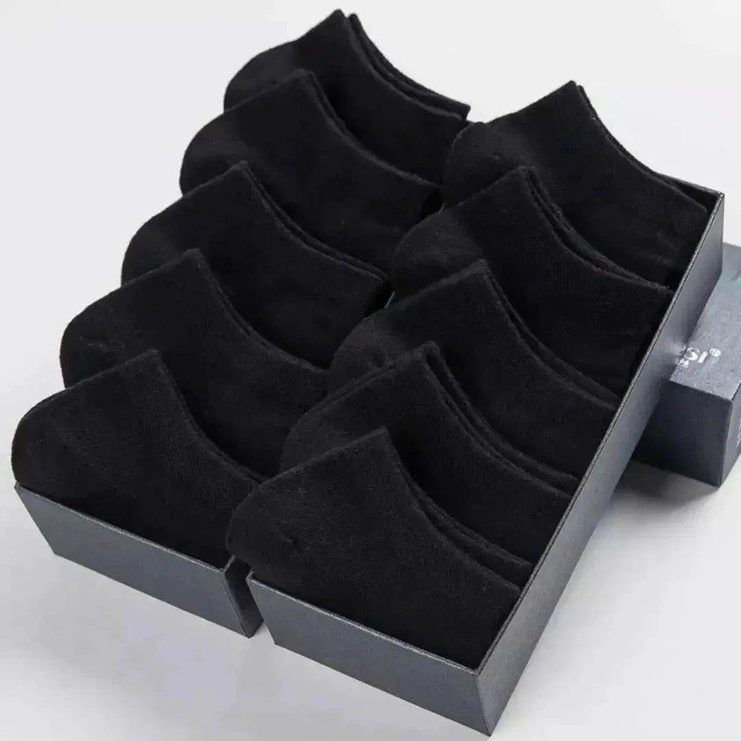 Ten pairs of black low-cut socks neatly packed in a cardboard box.