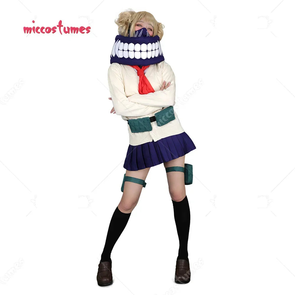 Woman wearing an anime cosplay costume with a cardigan, pleated skirt, red neckerchief, and teeth mask