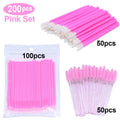 Disposable pink makeup applicators including microbrushes and eyelash spoolie wands in packaging.
