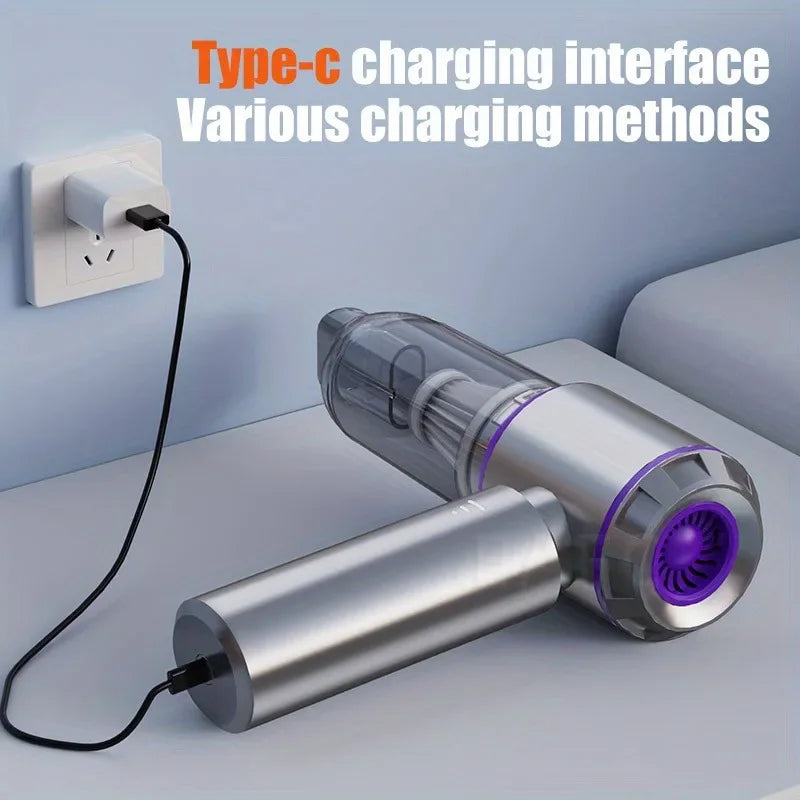Portable cordless vacuum cleaner charging with a USB Type-C cable connected to a wall adapter.