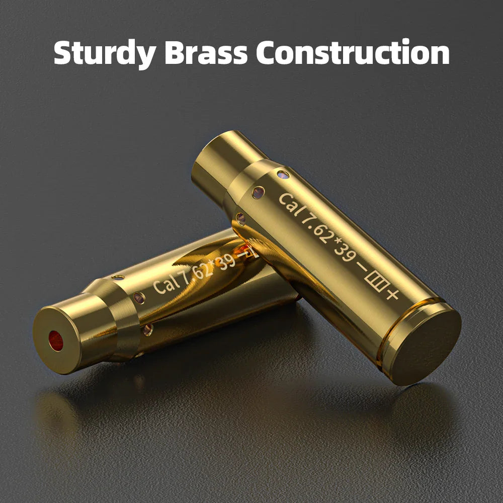 Two brass bullet-shaped laser sighter tools placed on a dark surface