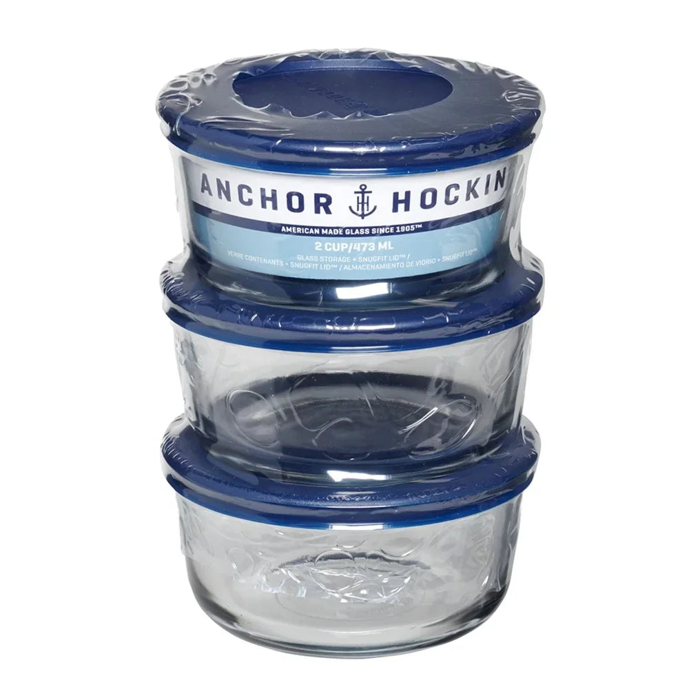 Stack of three round glass food storage containers in plastic packaging