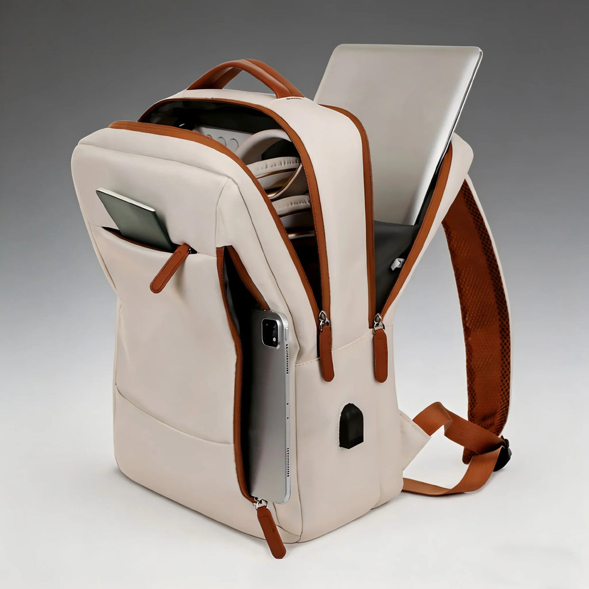 A beige laptop backpack with open compartments showing organized storage for electronics and personal items.