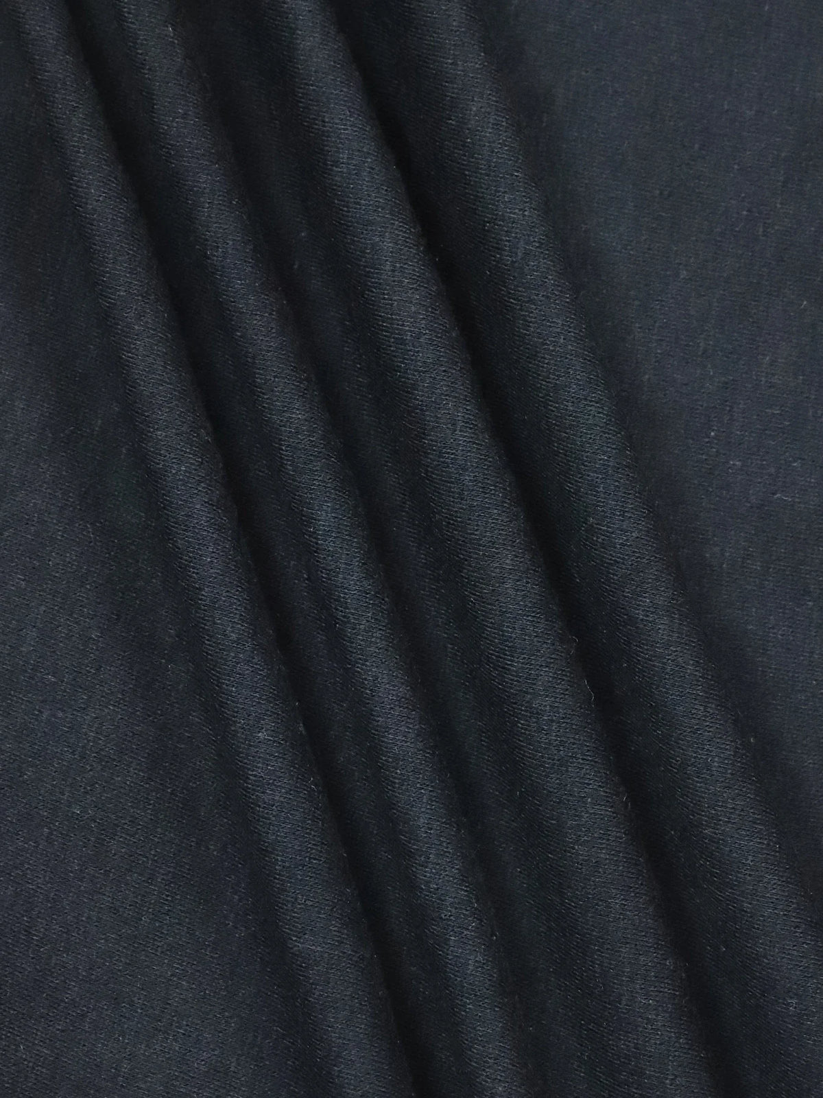 Folded black cotton fabric texture