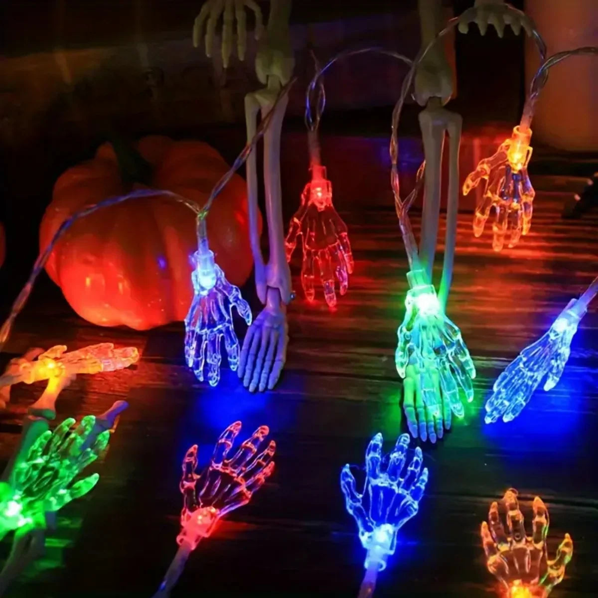 20 LED Halloween skeleton hand string light in multiple colors on a dark background – RGB