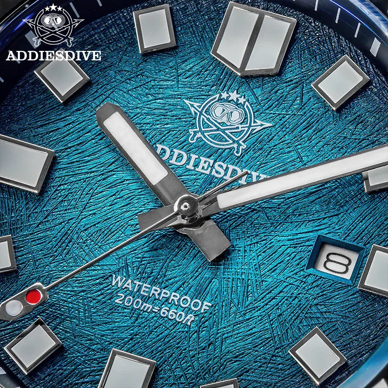 Close up of a blue textured watch dial with luminous markers and hands