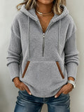 Women's gray fuzzy fleece hoodie with a half-zip neckline, drawstring hood, and front kangaroo pocket – Light Grey