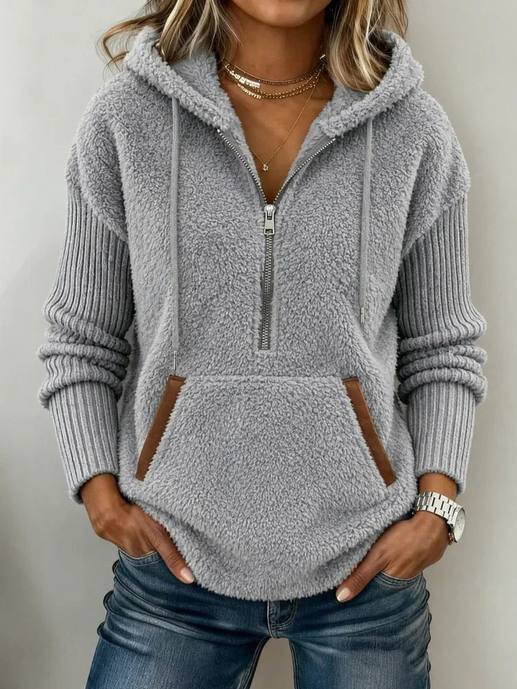 Women's gray fuzzy fleece hoodie with a half-zip neckline, drawstring hood, and front kangaroo pocket – Light Grey