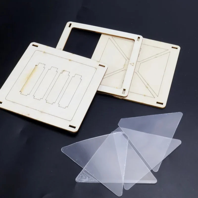 Assembled parts of a wooden and plastic DIY 3D holographic projector kit