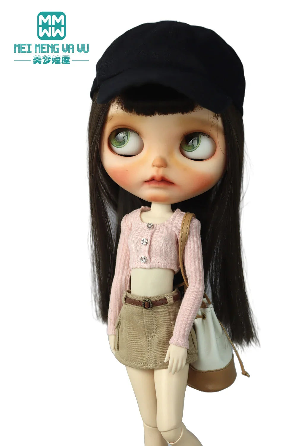 Doll in a black cap, light pink long sleeve cropped knit top, khaki miniskirt and bag