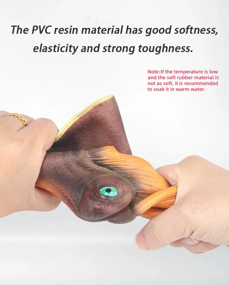 Hand stretching a soft rubber dinosaur puppet head to demonstrate material elasticity and texture.