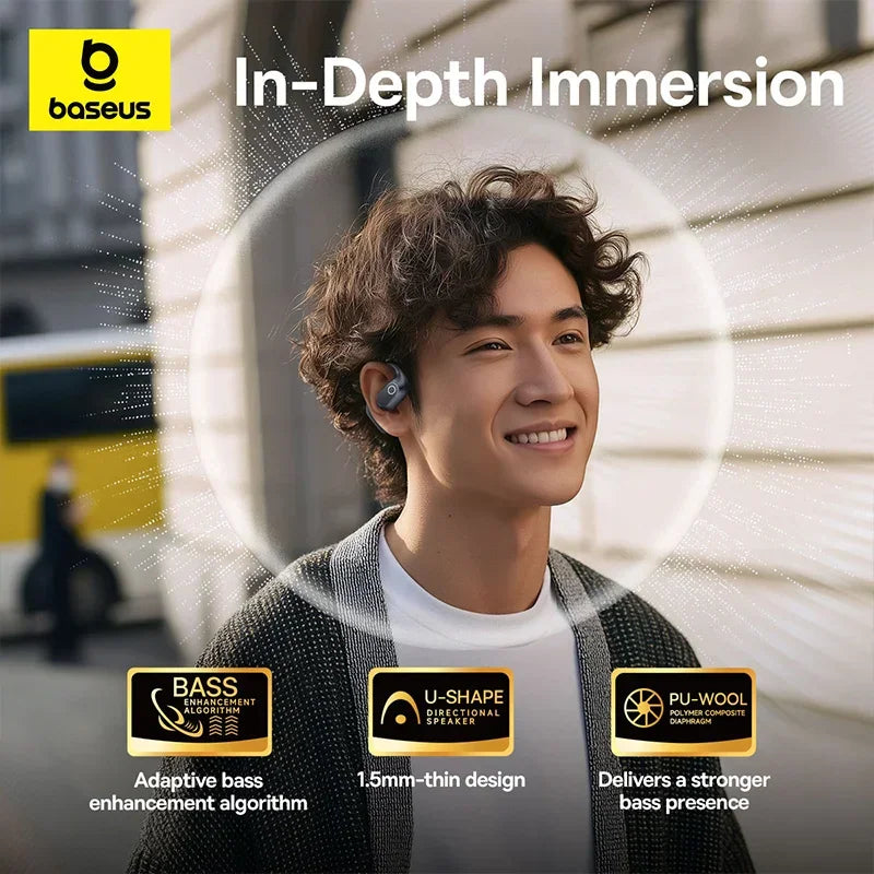 Man wearing black open-ear wireless earphones.