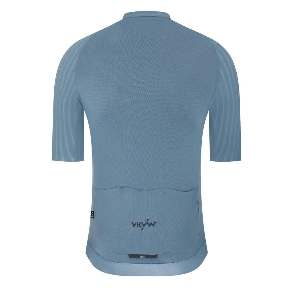 Back view of a blue men's short sleeve cycling jersey with rear pockets