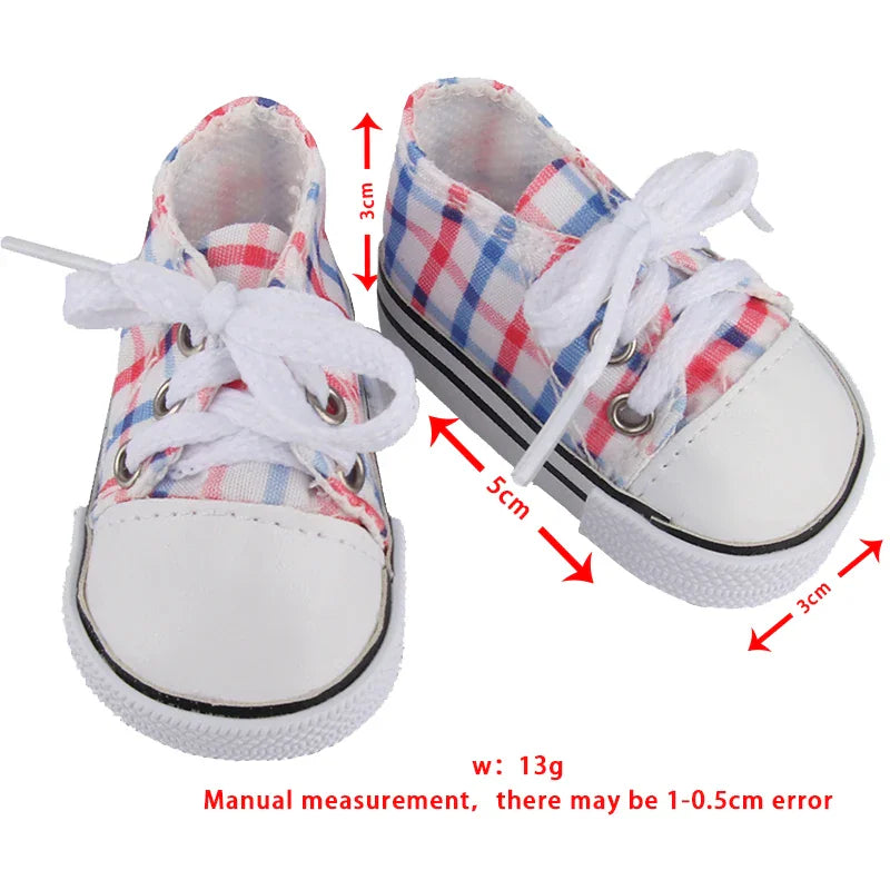 A pair of red, white, and blue checkered doll sneakers with white laces, shown with size measurements overlaid.